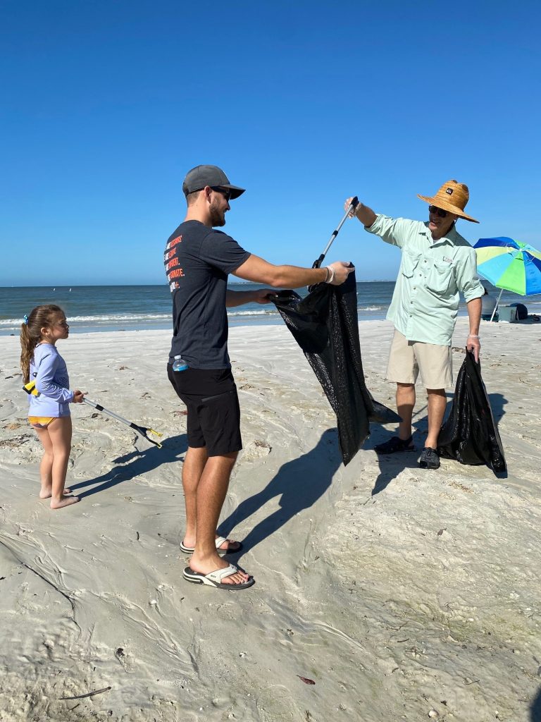 Employees cleaning the Beach